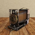 Vintage Style Digital Camera With Metal And Wooden Body On Wooden Table Top