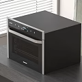Sleek Black Countertop Oven With Stainless Steel Trim For Modern Kitchen Counter