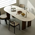 Modern Minimalist Travertine Oval Dining Table Set With Rattan Chairs For Cozy Home Dining Area