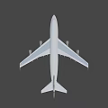 Dark Colored Airplane Flying With White Wings And Tail Logo In Sky