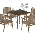 Stylish Wooden Dining Table Set With Rattan Chairs Teapot Cups And Potted Plant