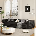 Black Sectional Sofa With Patterned Pillows Throw Blanket In Living Room Large Window Snowy View