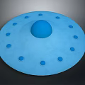 Blue Circular Object With Central Sphere And Surrounding Small Holes