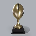 Golden Football Trophy with Shiny Metallic Surface and Black Base for Sports Championship Award