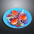 Fresh Salmon Slices with Red Onion Rings and Lemon Slices on Blue Polka Dot Plate