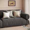 Gray Sofa With Decorative Pillows In Living Room With Beige Walls And Framed Art