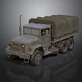Heavy Duty Military Truck Featuring Canvas Covered Cargo Bed And Six Wheel Design