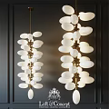 Modern Chandeliers With White Oval Shades And Golden Metal Frame Hanging On Dark Wall