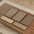 Wooden Coffee Table With Various Textured Metal Mesh Mats On Carpet And Wooden Floor