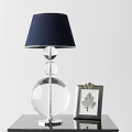 Modern Table Lamp with Dark Blue Lampshade Transparent Glass Base Beside Silver Leaf Pattern Frame 3d model