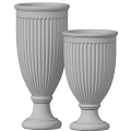 Decorative Ornament Set Featuring Black And White Fluted Vases With Pedestal Bases