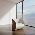 Modern White Single Seater Sofa With Curved Design By Large Windows And Sea View