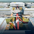Modern Industrial Park With Glass Facade Buildings Central Green Space And Red Walkway