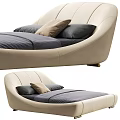 Modern Curved Design Double Bed With Beige Upholstered Headboard And Gray Bed Linen Pillows