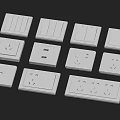 Assorted White Electrical Switches And Wall Sockets With Different Designs