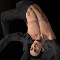 Man In Dynamic Acrobatic Pose Shirtless With Black Pants And Jacket Against Black Background