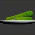 Two Whole Fresh Green Cucumbers With Sliced Pieces On Blue Plate