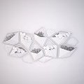 Geometric Wall Decor With Wooden White And Gray Planters Holding Green Plants