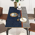 Dining Table Set With Blue Houndstooth Tablecloth Golden Plates Wine Glass And Brown Chairs