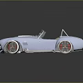 Blue Vintage Convertible Sports Car With White Stripes Red Rims And Chrome Exhaust Pipes