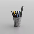 Perforated Black Pen Holder With Colored Pens Scissors Ruler On White Background
