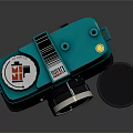 Vintage Digital Camera With Turquoise Top And Black Body Featuring Classic Lens And Cap