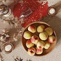 Fresh Peaches in Ceramic Bowl on Rustic Wooden Table with Candles and Wine Glass