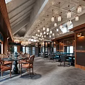 Modern Café Interior Design With Pendant Lights Wooden Tables And Dining Chairs