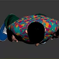 A Man Wearing Colorful Patterned T-Shirt Green Pants And Blue Shoes Against Gray Background