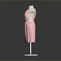 Man Modeling Pink Polka Dot Halter Dress on White Mannequin Stand