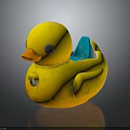 Yellow Rubber Duck Toy With Orange Beak Gray Eyes And Blue Wings