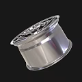 Shiny Silver Automotive Tire Rim With Modern Spoke Design And Center Logo