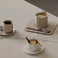 Elegant Decorative Ornament Set with Coffee Cups Coasters and Spoons on Marble Tabletop