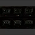 Multiple Black Walkie Talkies Charging On Desktop Dock Station For Communication