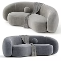 Curved Beige And Brown Sofa With Gray Throw Blanket And Round Pillow