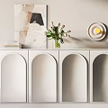 White Entryway Side Cabinet Arched Design With Vase Flowers Books Wall Art And Round Lamp