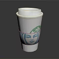 Starbucks Coffee Cup With Silver Lid And Green Logo Blue Face Design