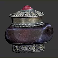 Red Vessel With Silver Decorated Lid And Red Gemstone On Dark Background