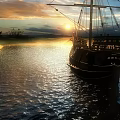 Elegant Yacht Sailing On Water At Sunset With Golden Light And Cloudy Sky