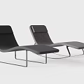 Modern Curved Lounge Chair With Metal Frame And Comfortable Dark Gray Upholstery Design