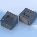 Two Black Desktop Printers On Light Blue Background With Compact Design