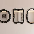 Three Decorative Mirrors with Black Frames and Various Shapes Hanging on White Wall 3d model