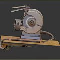 Vintage Bench Grinder Equipment on Yellow Wooden Base with Dark Background and Reflection