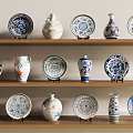 Decorative Blue and White Ceramic Wares Displayed on Wooden Shelves