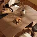 Modern Wooden Dining Table Set with Black White Chairs Vase and Nuts Bowl on Wooden Floor