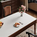 Cozy Restaurant Table With Pink Flowers Vase Croissant Fruit Bowl Leather Chair And Wooden Floor