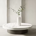 Round White Marble Coffee Table with White Vase and Green Plant in Modern Minimalist Interior