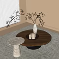Round Wooden Coffee Table With White Vase Black Twigs And White Marble Side Table