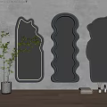 Irregular Shaped Mirrors with Gray Frames Hanging on Wall Reflecting Modern Interior Spaces