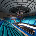 Spacious Indoor Sports Arena With Blue Seats Circular Structure And Large Screen